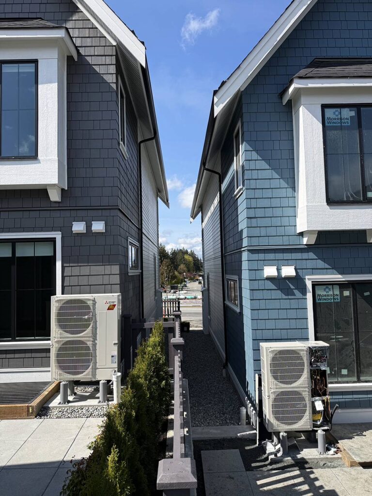 Condensers being installed for a townhouse complex.